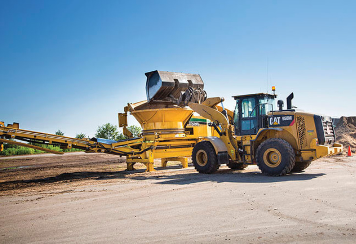 a tub grinder on a jobsite